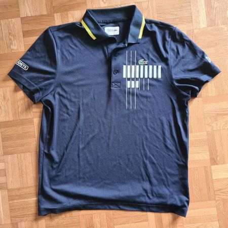 Polo Lacoste bleu fonçé taille L très bon état