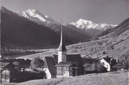 Münster im Goms (VS) Dorfansicht mit Weisshorn. 1965