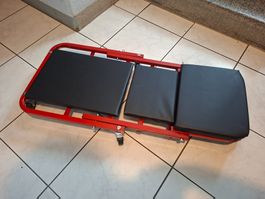Werkstatt-Montageliege rot schwarz gebraucht