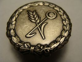 Insigne de cuisinier militaire suisse.