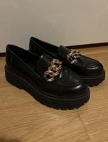 Chunky Black Loafers with Gold Chain Detail