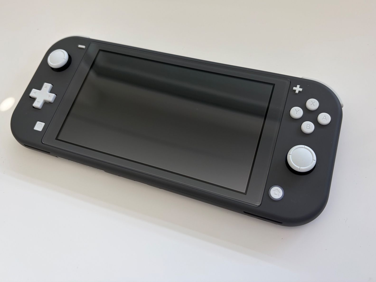 Nintendo Consoles: Nintendo Switch Lite Grau/Schwarz – Neuf (Voir description) à Reinach AG par mali.kes