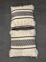 2 Kissen von DONE im Boho-Stil mit dekorativer Verzierung