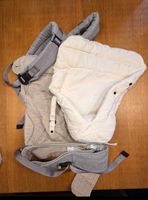 Babytrage Ergobaby grau mit Neugeborenenaufsatz hell