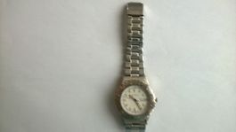 Montre M-Watch  métal Swiss made TBE