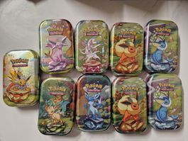 7x Pokémon Mini Tins Prismatic Evolutions ENGLISH – OVP