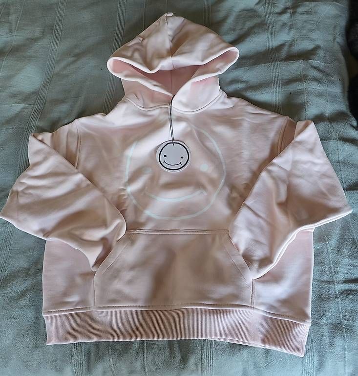 Maglioni & Felpe: Hellrosa Smileyface Hoodie, XXS – Nuovo e nell'imballaggio originale da Hüttwilen venduto da Haexli50