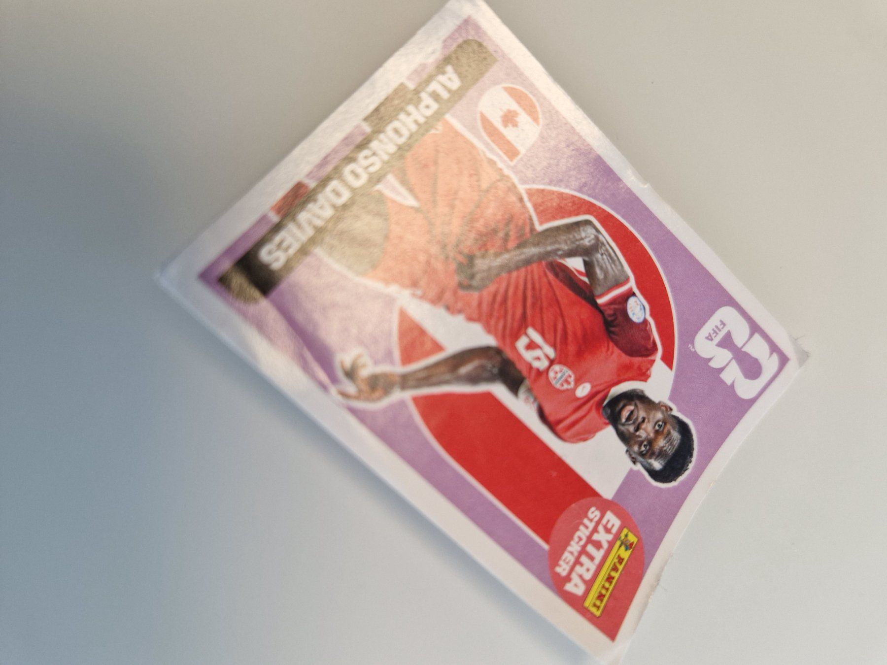 Panini Alben: Panini Extra Sticker Alphonso Davies FIFA WM 2026 – Gebraucht aus Gossau SG von Docla84 2