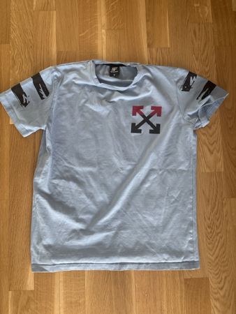 T-shirt bleu clair avec motif flèches - Taille M 😎