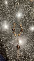 Elegante Herbst-Halskette mit braunen und goldenen Perlen