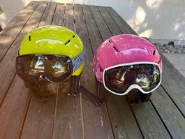 Zwei Nord Kinder-Skihelme mit Skibrille