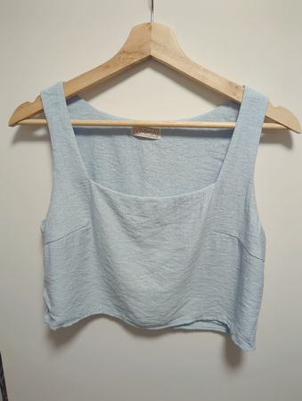 light blue sleeveless cropped top