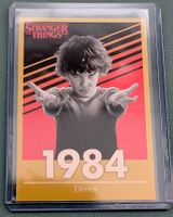 Stranger Things Eleven #110 Gold Parallel – Panini This Is