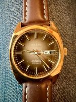 Montre Orano NOS Swiss Automatique day date marron vintage