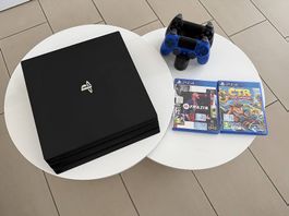 PS4 Pro + 2 Controller + Sony-Ladestation + 4 Spiele