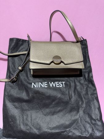 Elegant Nine West gold crossbody bag with dust bag