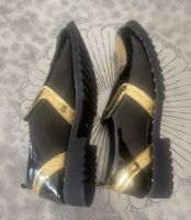 Chaussures unisexe noir et or taille 43