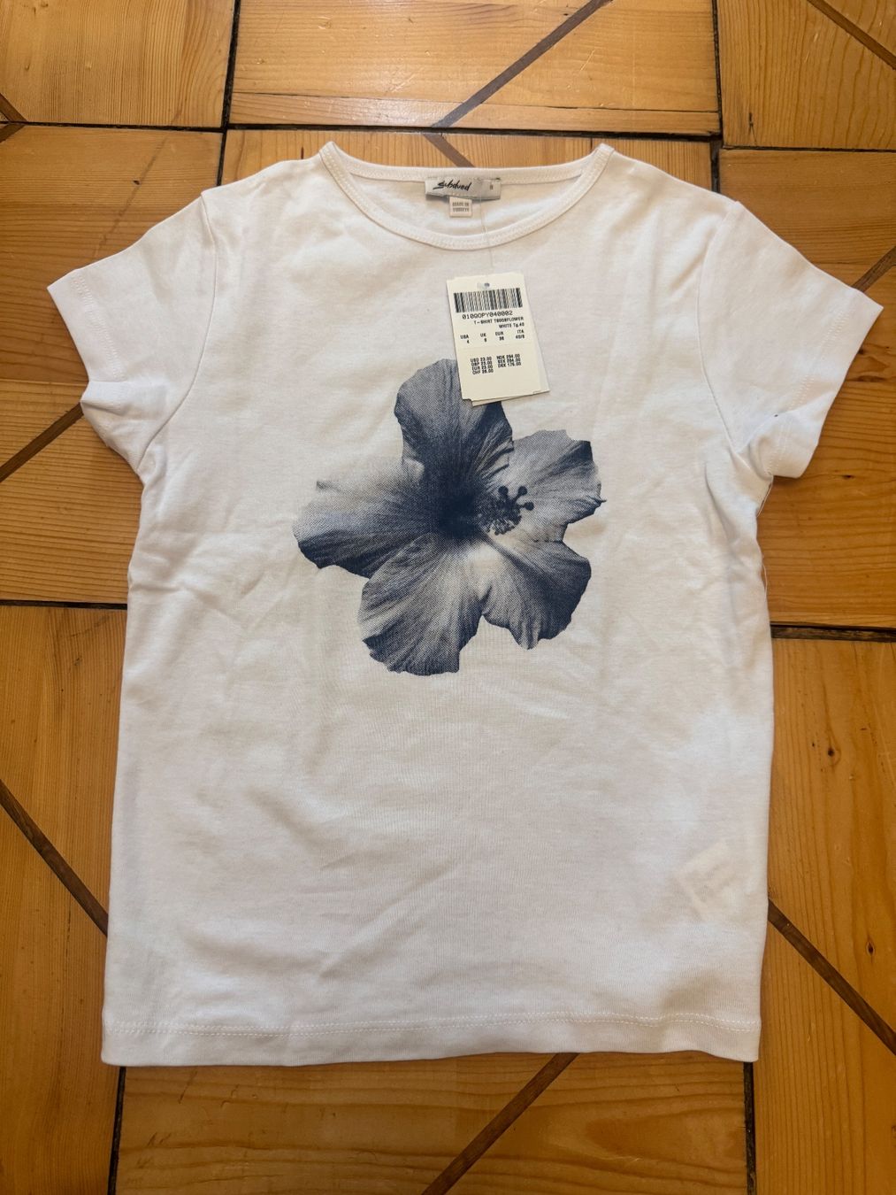 T-shirt: Subdued Printed T-Shirt – Nuovo (secondo la descrizione) da Zürich venduto da catemiranda