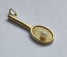 Goldanhänger 18kt. GG Tennis-Schläger mit Perle