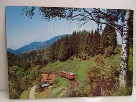 Alte Postkarte: Roter Zug ET 25 fährt durch Schwarzwald