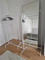 Two white clothes racks