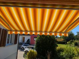 Gelenkarmmarkise gestreift orange weiss