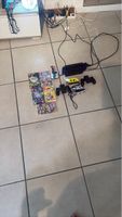 Nintendo Switch avec jeux et accessoires vendu dans l’état.