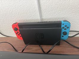 Nintendo Switch Konsole mit Zubehör und zwei Spielen