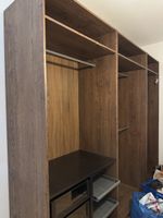 Wardrobe system dark wood effect with shelves and rails