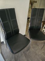Schwarze Stühle