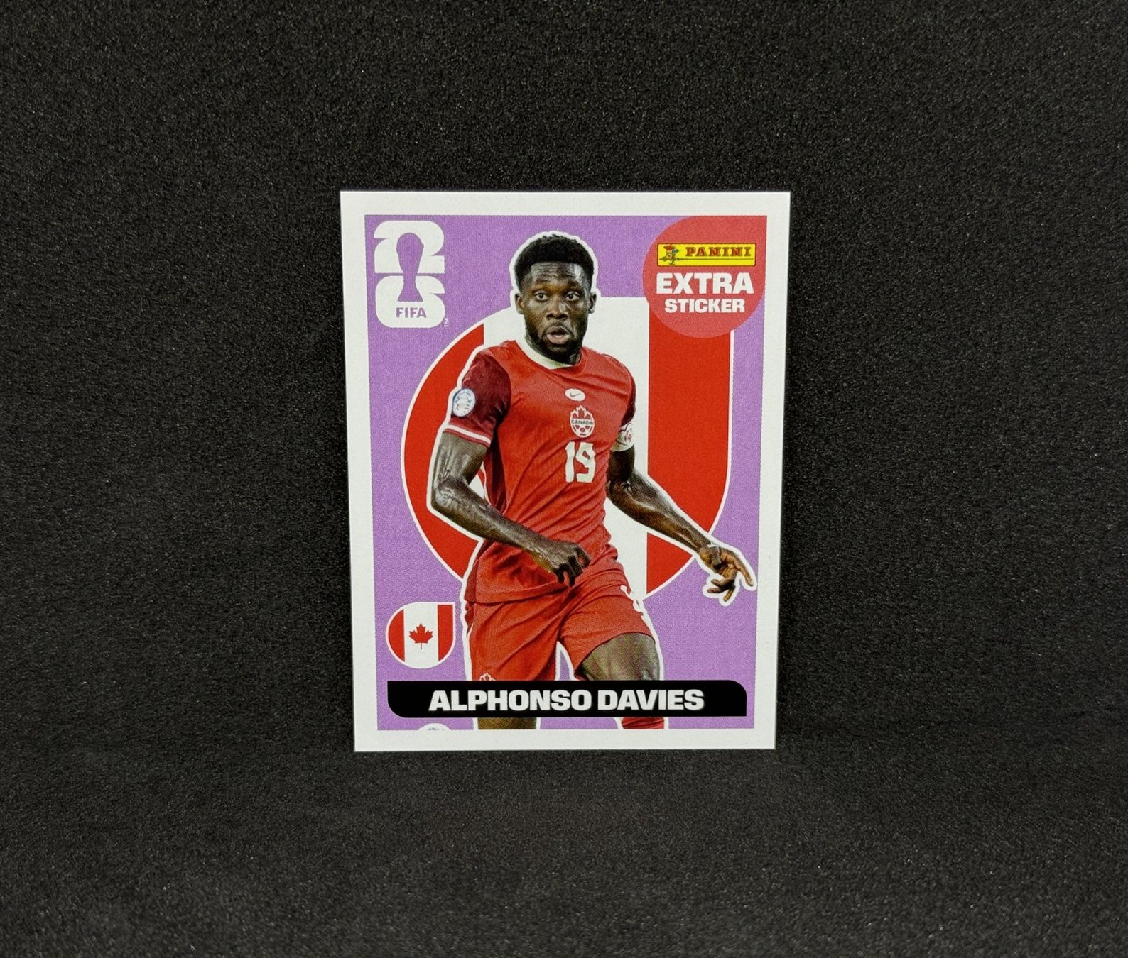 Panini Carte collezionabili: Alphonso Davies Panini 2026 Extra Sticker Regular Base RARE – Nuovo (secondo la descrizione) da Blonay venduto da DeckZone
