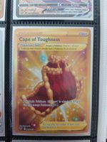 Cape of Toughness Gold Card - Pokemon Englisch