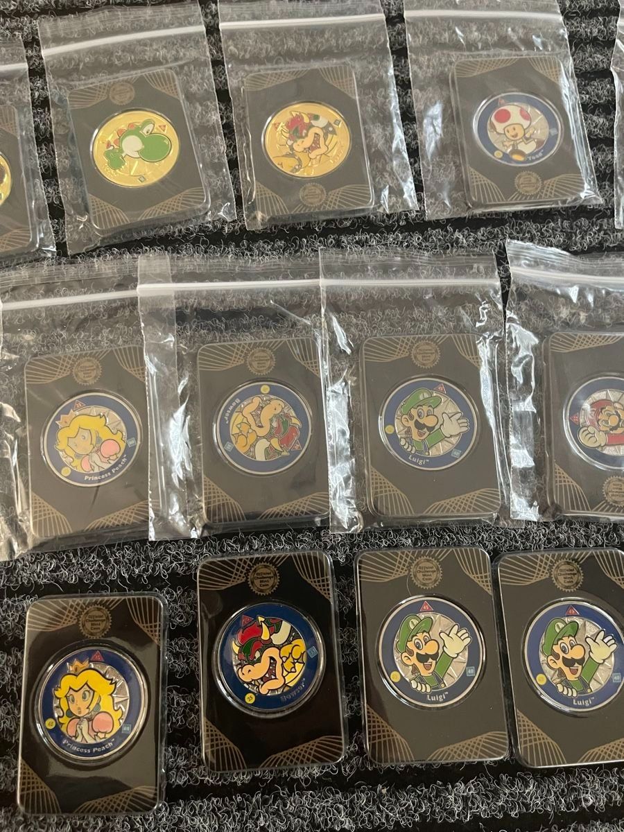 Tutti le monete: 18 Stk. Nintendo Super Mario Challenge Coins + Displaybrett – Nuovo e nell'imballaggio originale da Aesch BL venduto da CollectorsBest 4