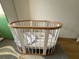 Oval bed growing with the baby