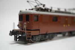 † e21 Trix Express BLS Ae 4/4 braun