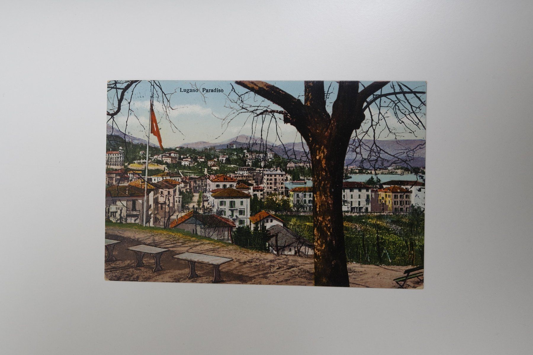 Cartoline postali: Ansichtskarte Lugano Paradiso mit Baum und Bänken alt – Usato da Lausen venduto da mexico81