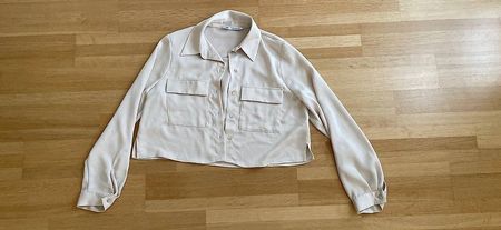 Kurze cremefarbige Zara-Bluse Gr. S