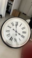 Horloge murale ronde chiffres romains