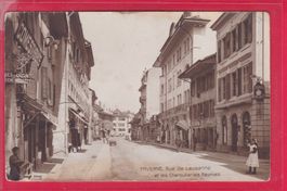 PAYERNE, RUE DE LAUSANNE ET LES CHARCUTERIES RÉUNIES, 1913