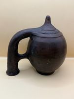 Ancienne gargoulette en terre cuite noire artisanale