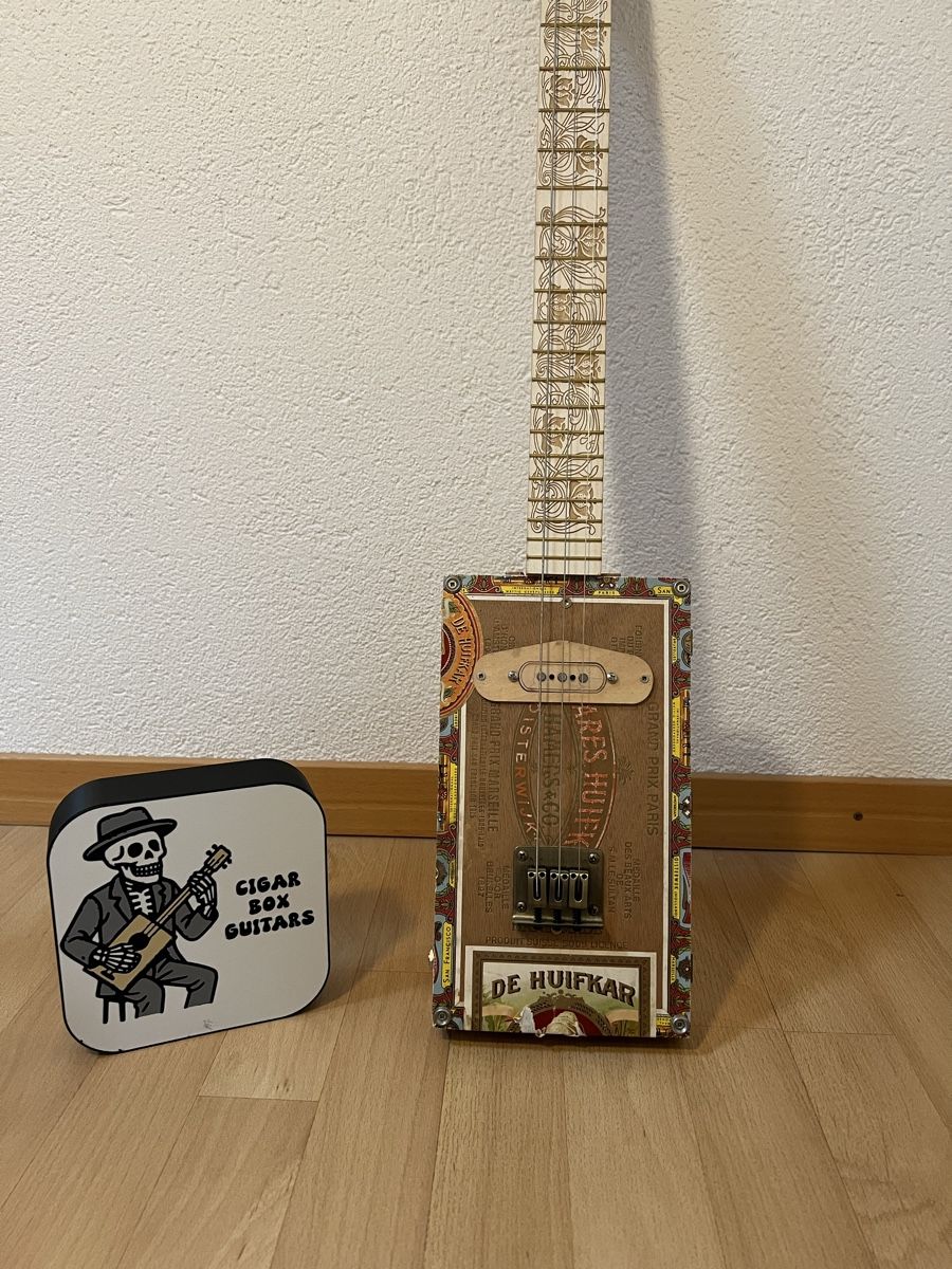 Strumenti musicali: Cigar box guitar – Usato da Corcelles NE venduto da Yabo