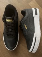 Schicke Puma Sneakers, schwarz/gold, Gr. 38.5, neuwertig