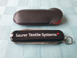 Taschenmesser Saurer Textile Systems