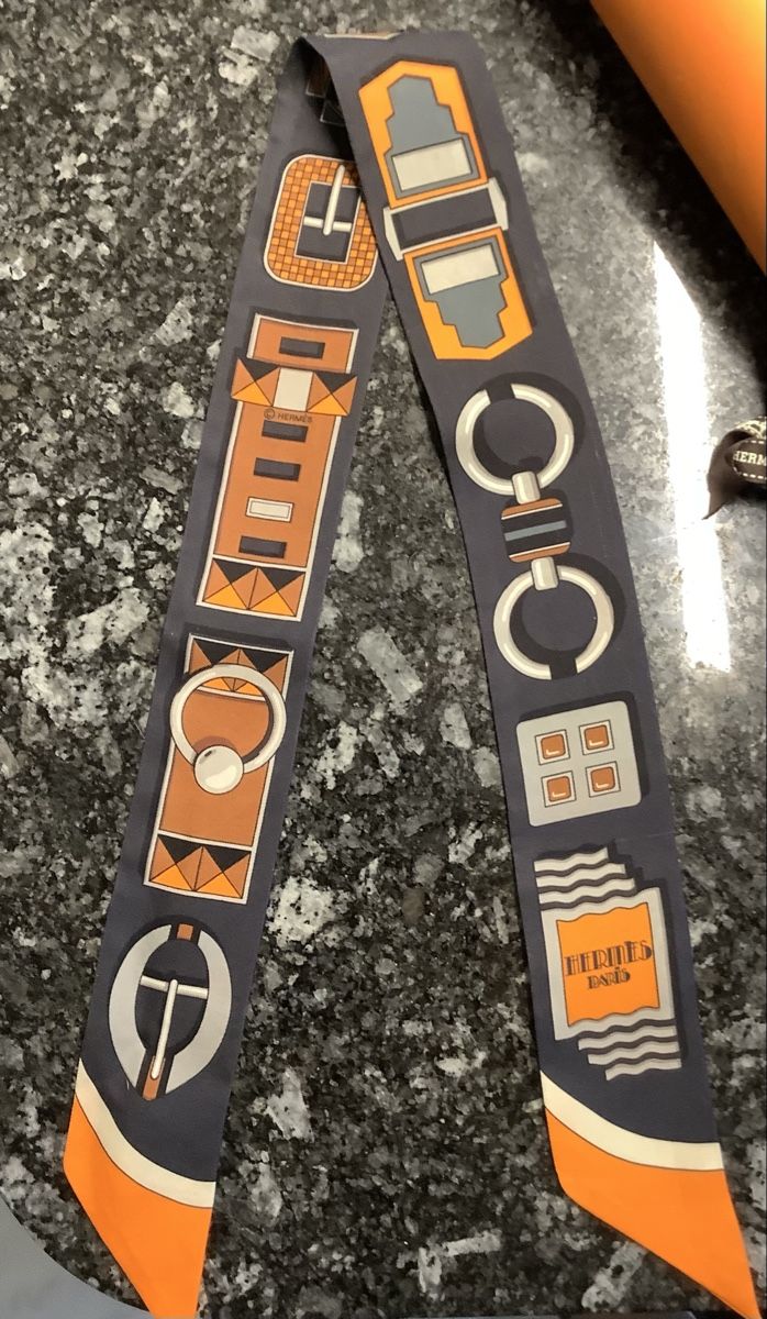 Hermès Foulard & Sciarpe: Hermès Twilly Seidentuch Grau Orange  – Usato da Biel-Benken BL venduto da Lanma 1