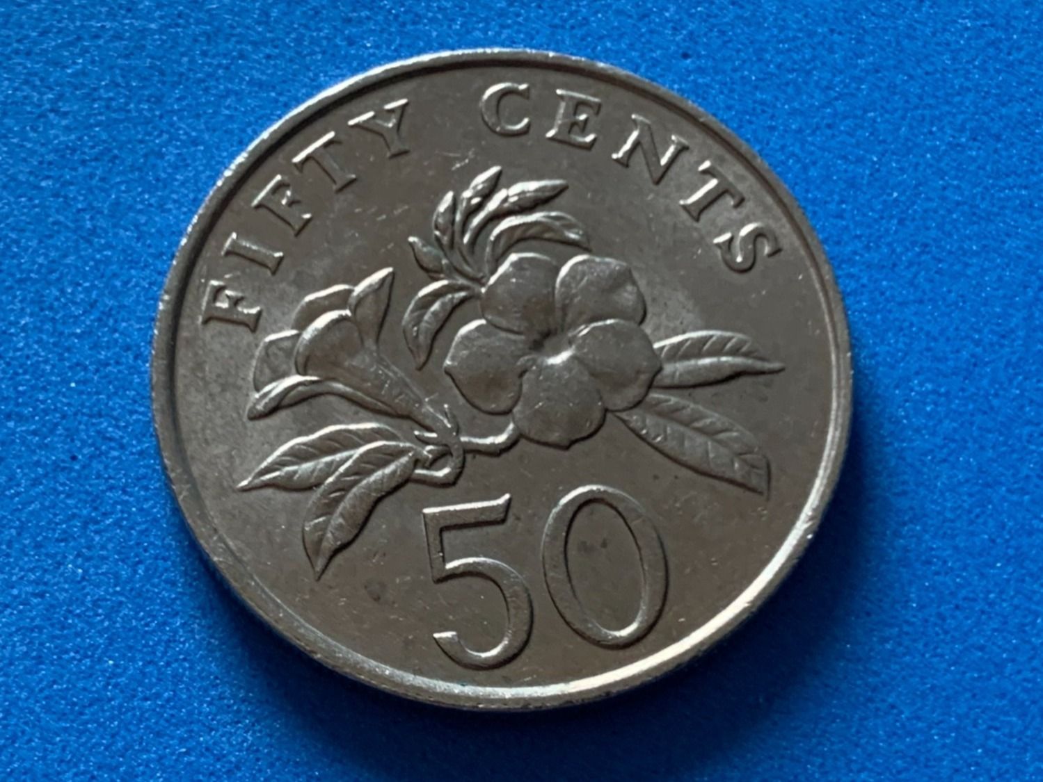 Tutti le monete: Singapore - 50 Cents 1987 – Usato da Corcelles NE venduto da AJKader