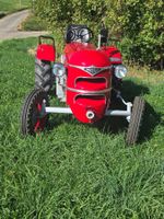 Tracteur Meili rouge en bon état de fonctionnement