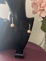 Schöne Ohrringe mit Perle