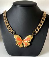 Gold plated steel butterfly necklace.