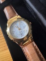 Montre Yves Saint Laurent dorée bracelet cuir marron