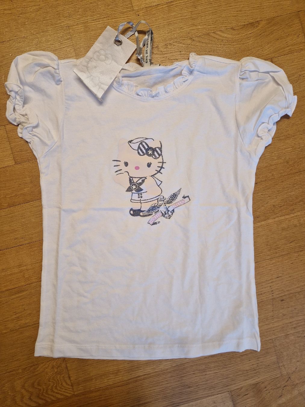 Blusen, T-Shirts & Tops: T-shirt fille Hello Kitty taille 164 – Neu und originalverpackt aus Penthaz von Sosotroc